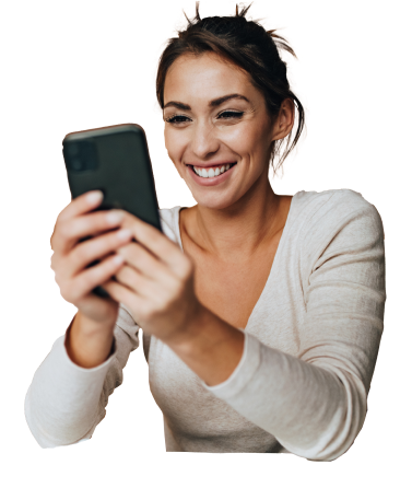 A woman smiling while using a cell phone, enhancing her Customer Experience.